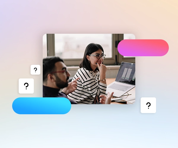 A woman in front of a computer in a meeting, a man talking in the foreground. Question marks around the image. 