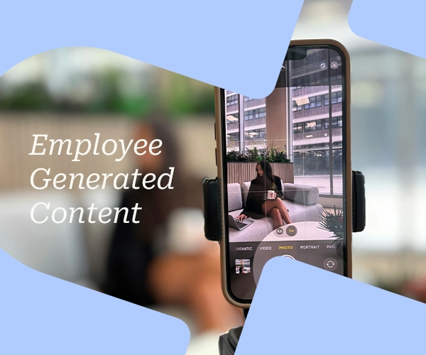 Phone on a tripod filming a woman on a sofa by a window; text reads "Employee Generated Content".