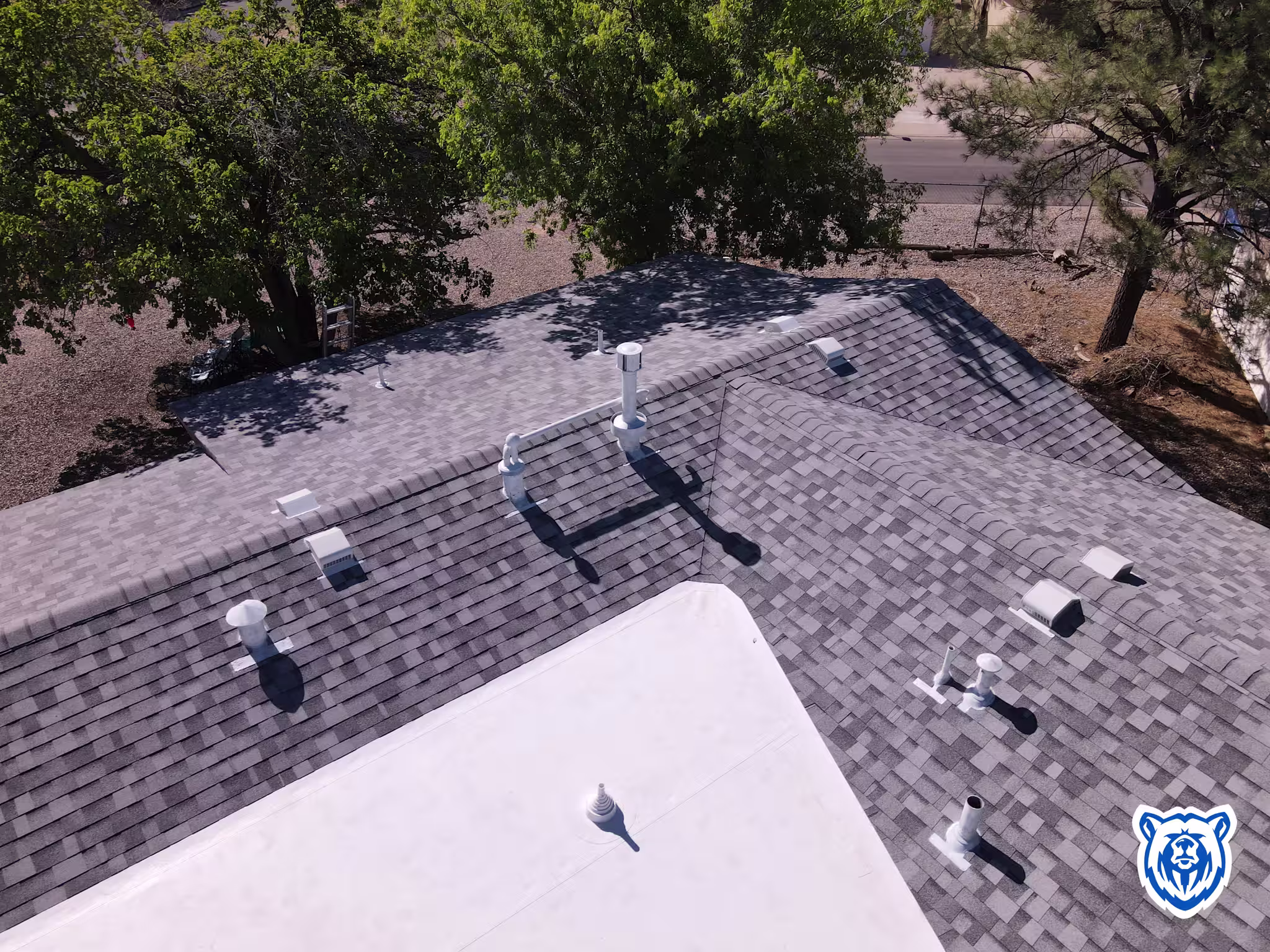 Mixed roof replacement with shingles and TPO in Rio Rancho NM