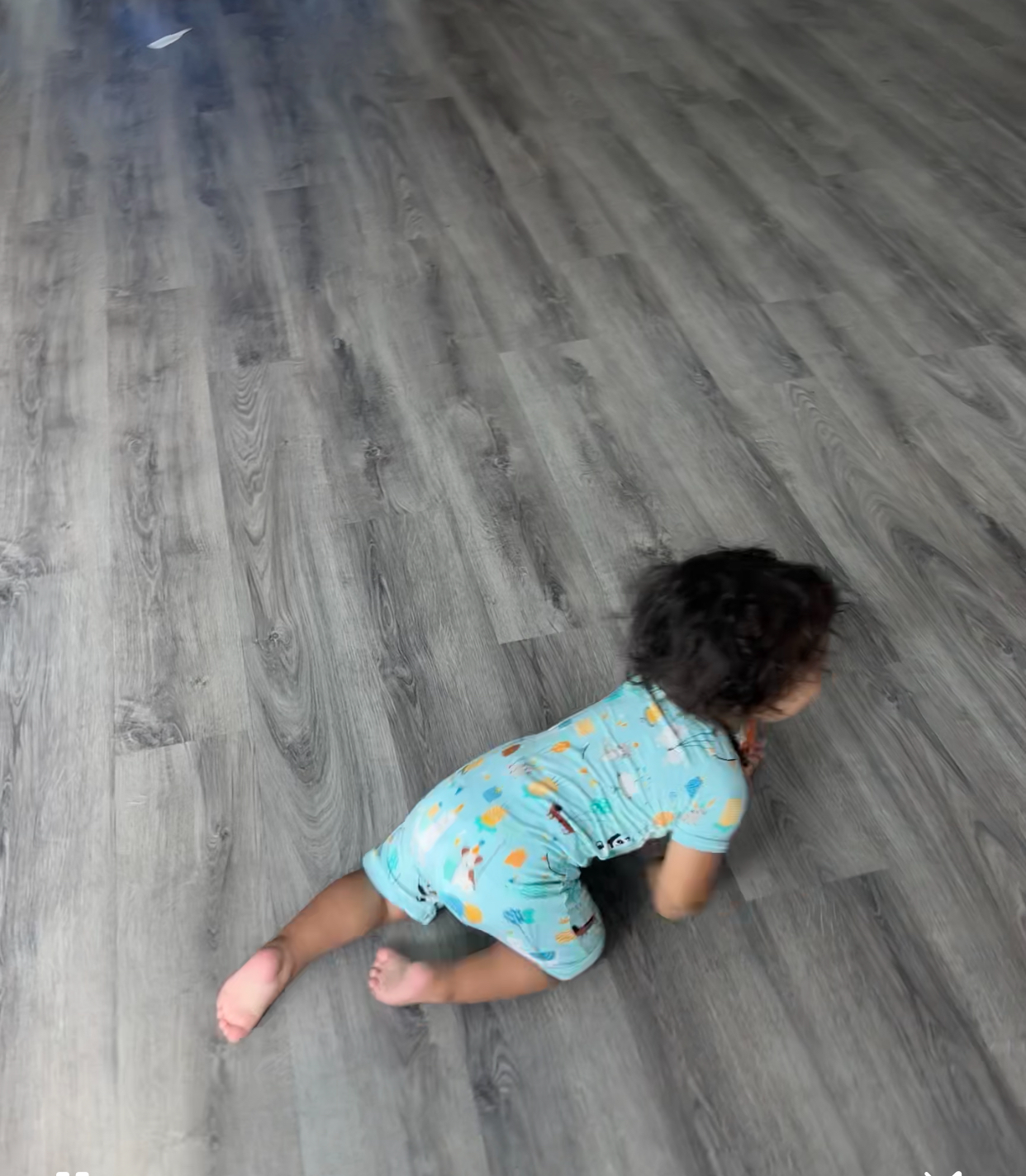 A crawling baby receives neurologically focused chiropractic care.