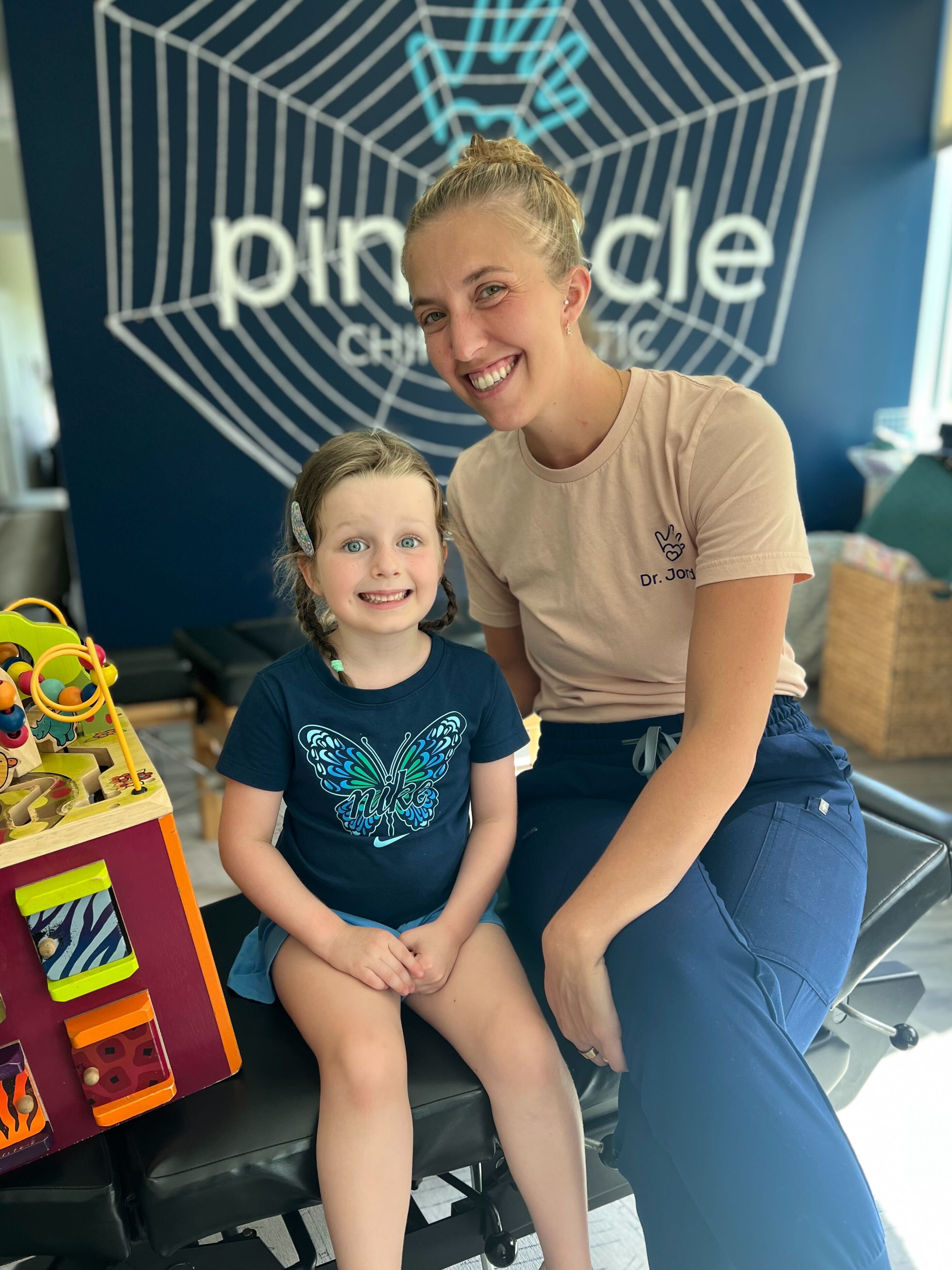 Smiling child at pediatric chiropractic visit for chronic ear infections
