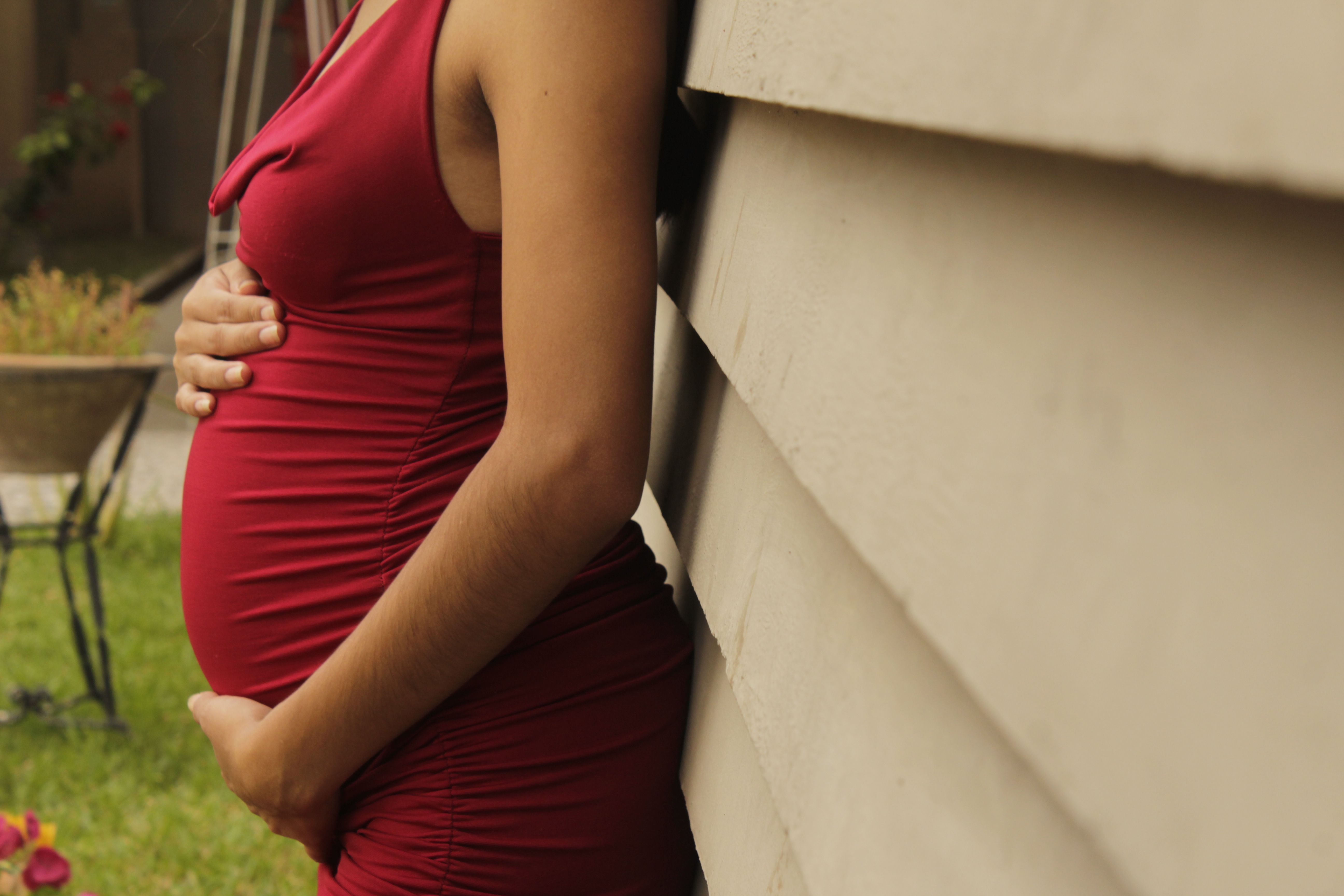Prenatal woman in red dress