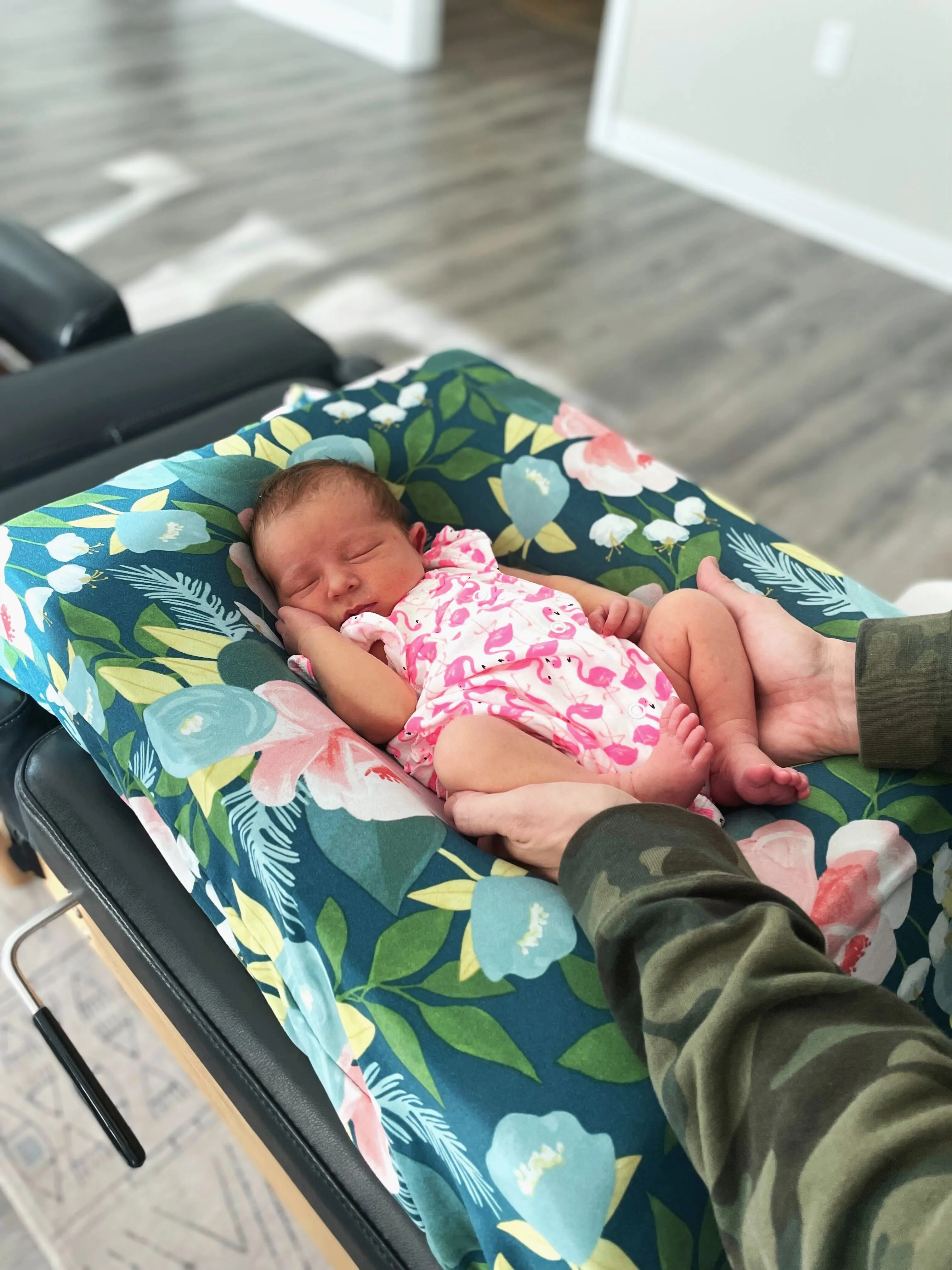 A newborn resting on a specialized pillow during a gentle infant chiropractic assessment at Pinnacle Chiropractic