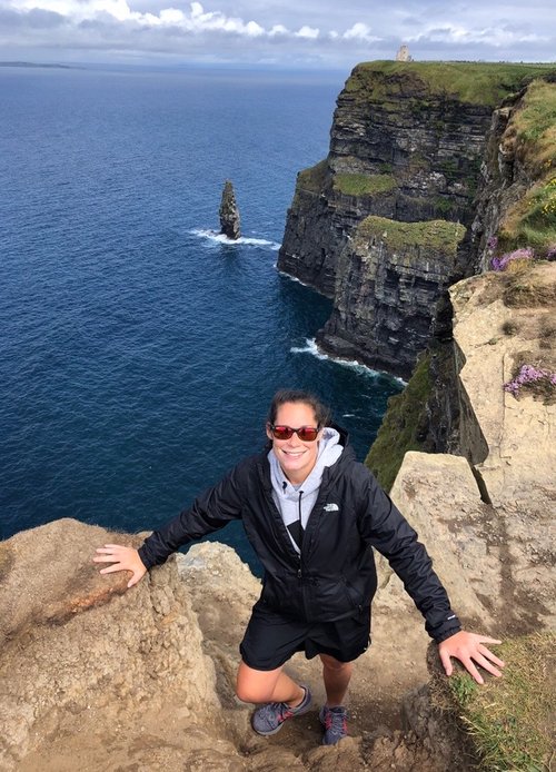Jenna Wenk posing at the Cliffs of Moher in Ireland