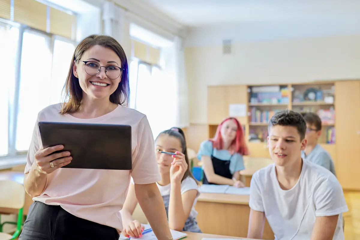 a teacher using tech devices for her class