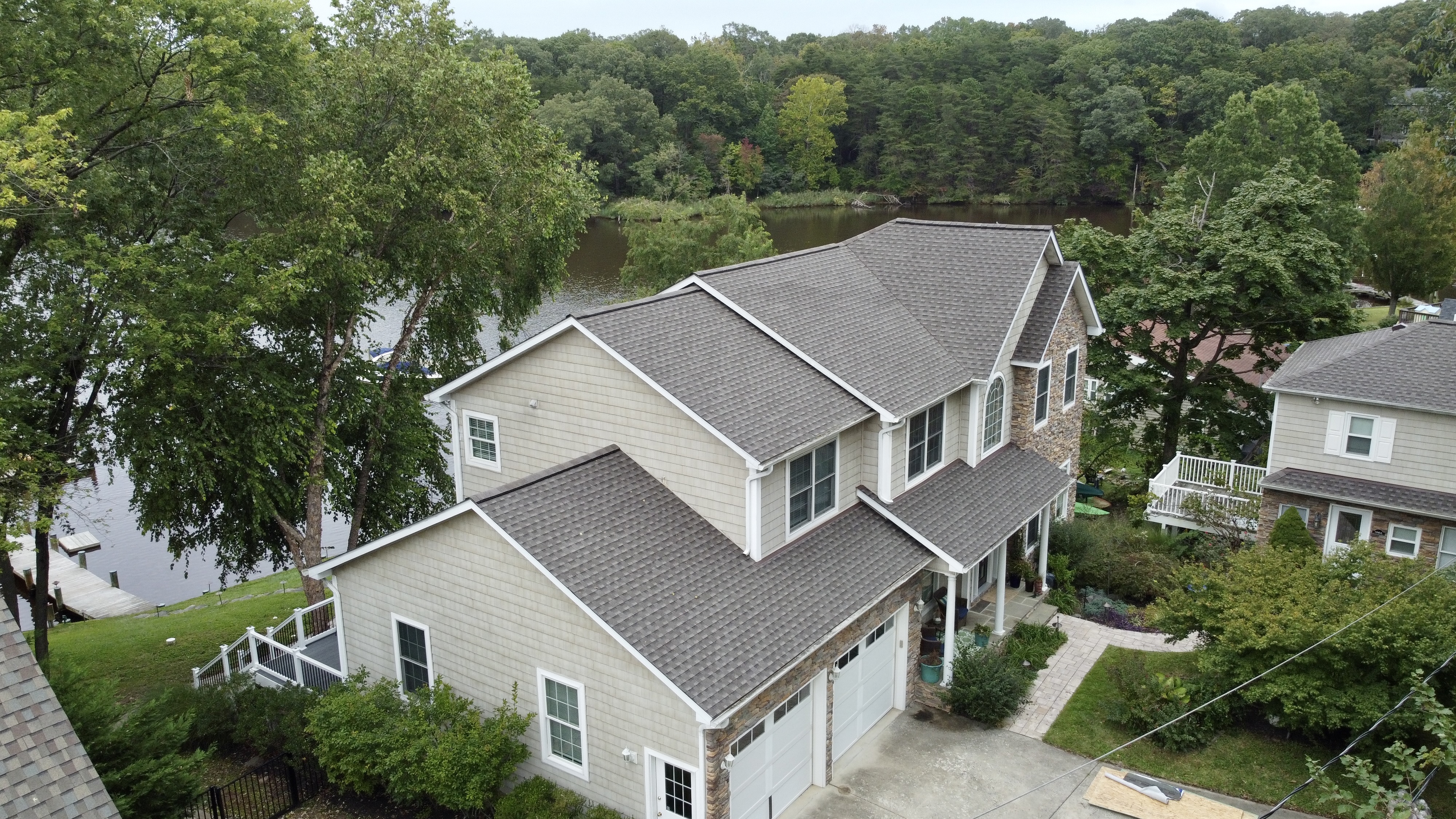 A completed photo of a shingle roof replacement in Lake Shore, MD