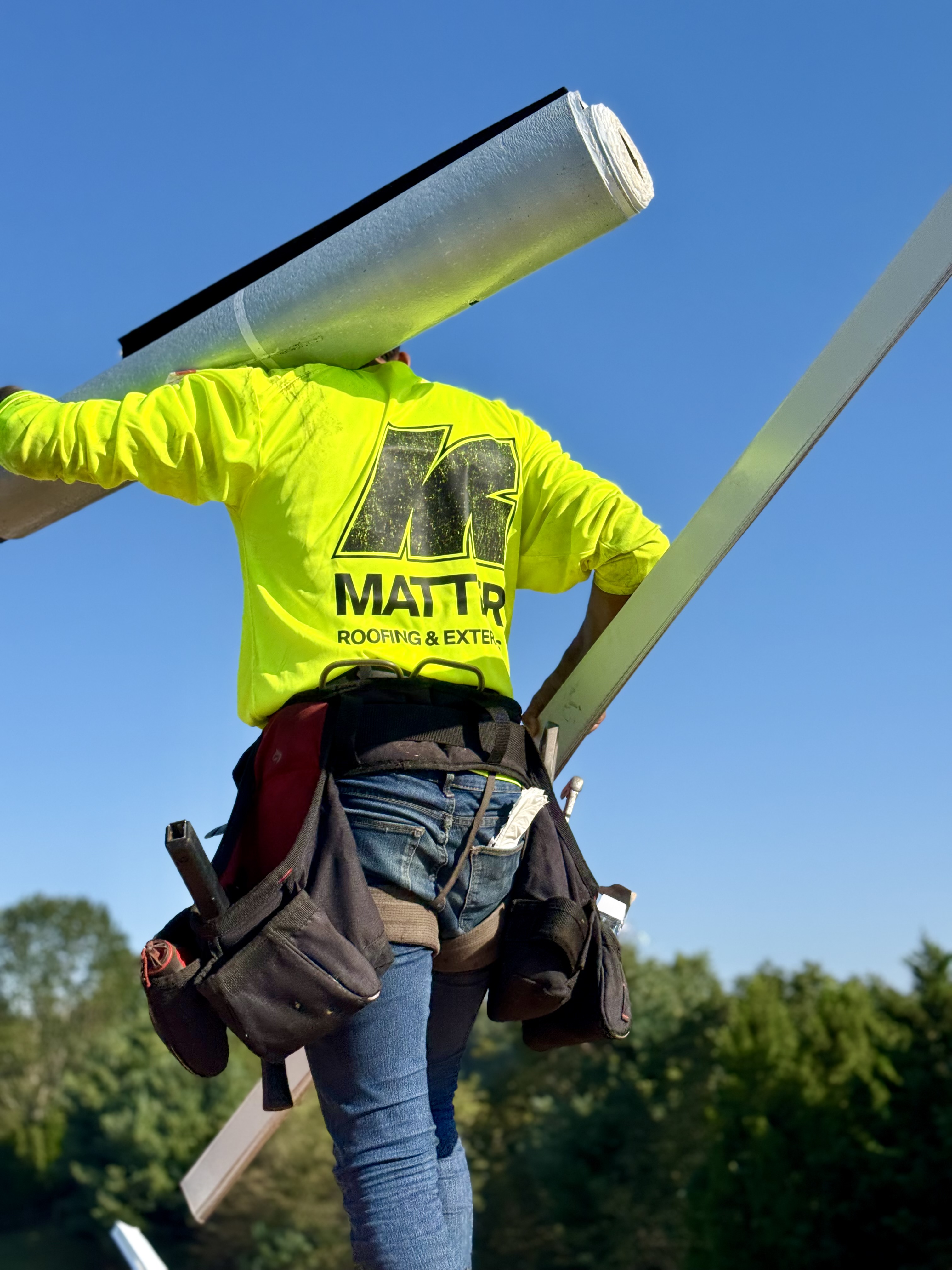 A Matter Roofing crew member on the roof.