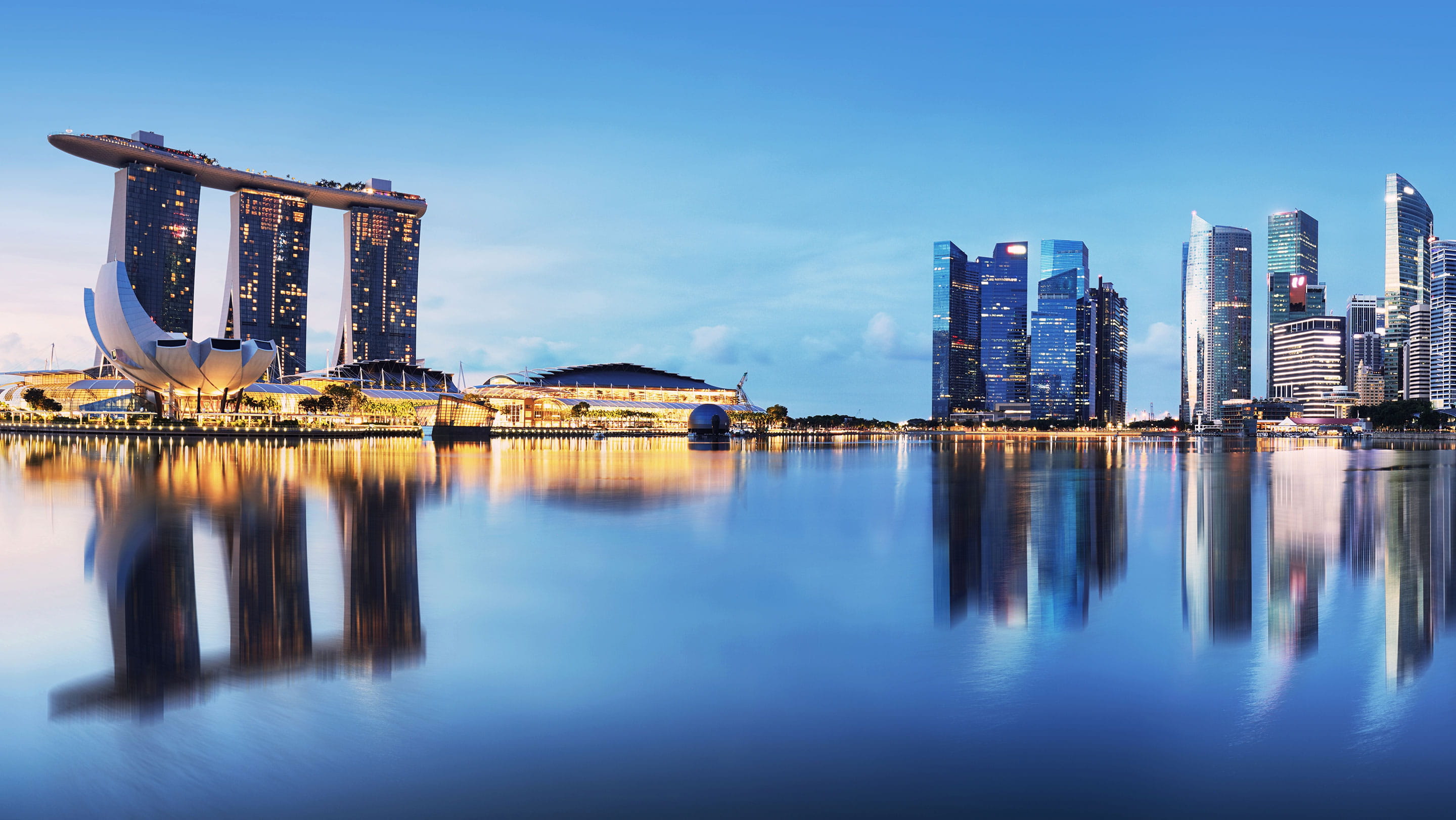 Singapore skyline at Marina Bay with Marina Bay Sands and the financial district, illustrating Singapore’s growing asset management and financial services sector.