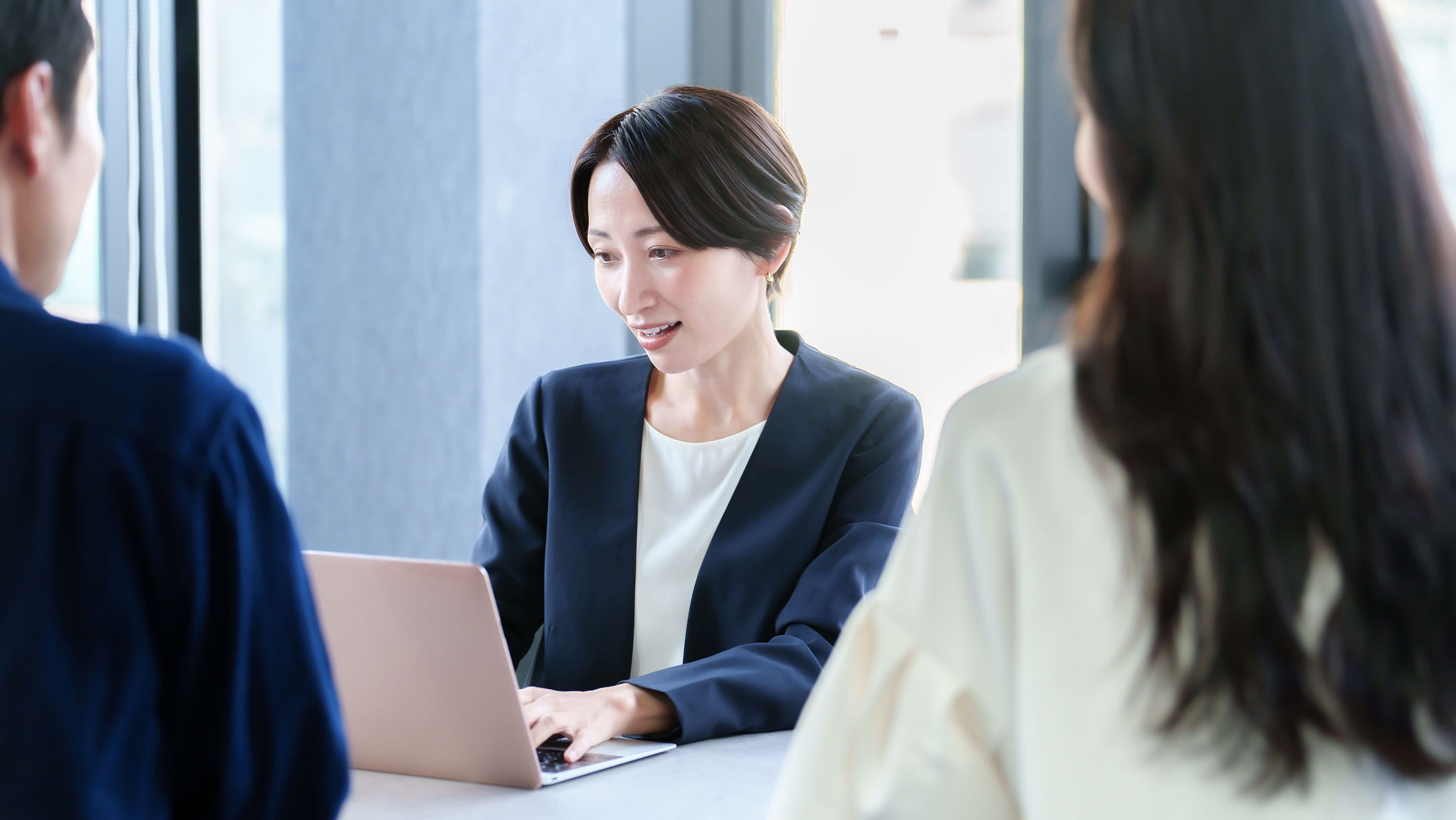 Business professionals discussing employment during a meeting in Japan, illustrating how foreign companies can hire employees through Employer of Record (EOR) services without setting up a local entity.