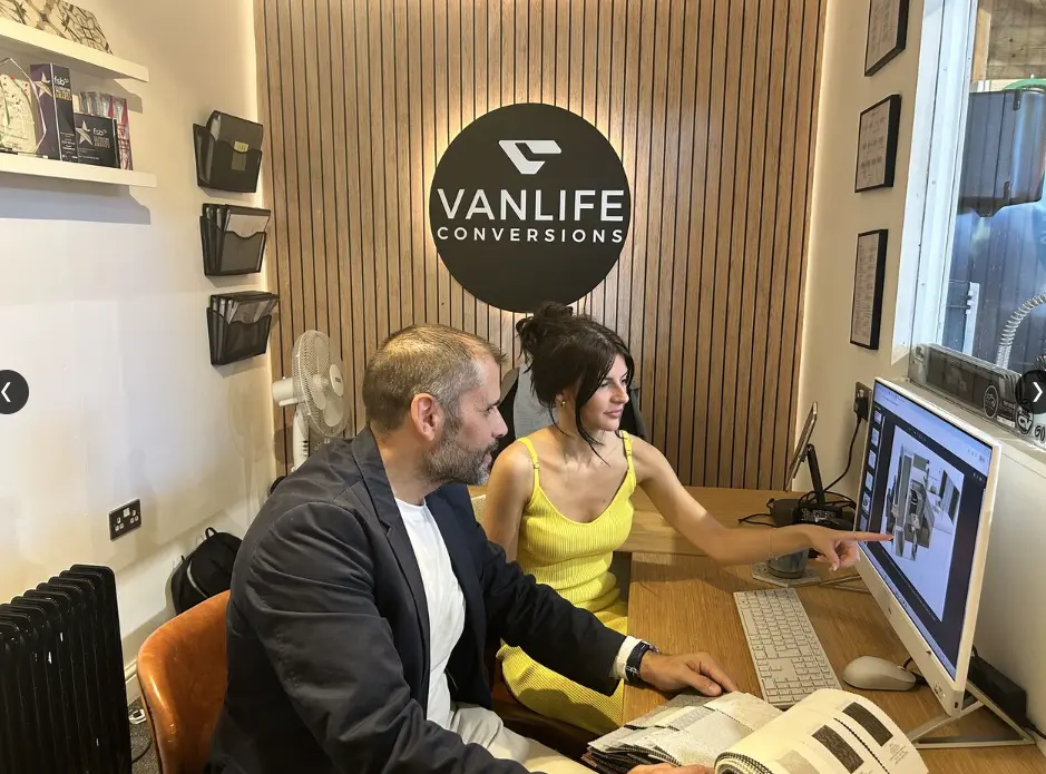 Harvey and Gemma looking at van renders
