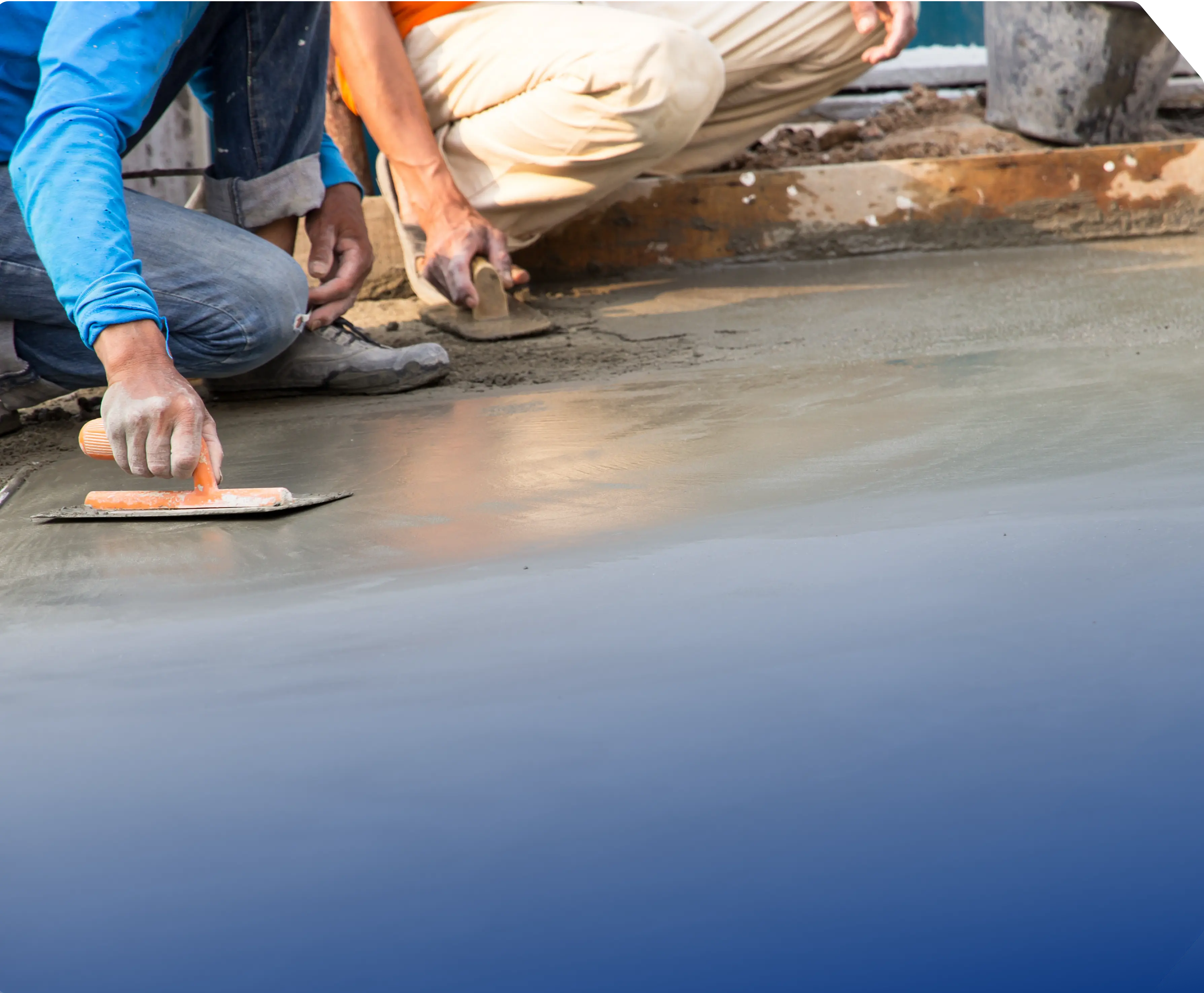 two men working on a concrete slab