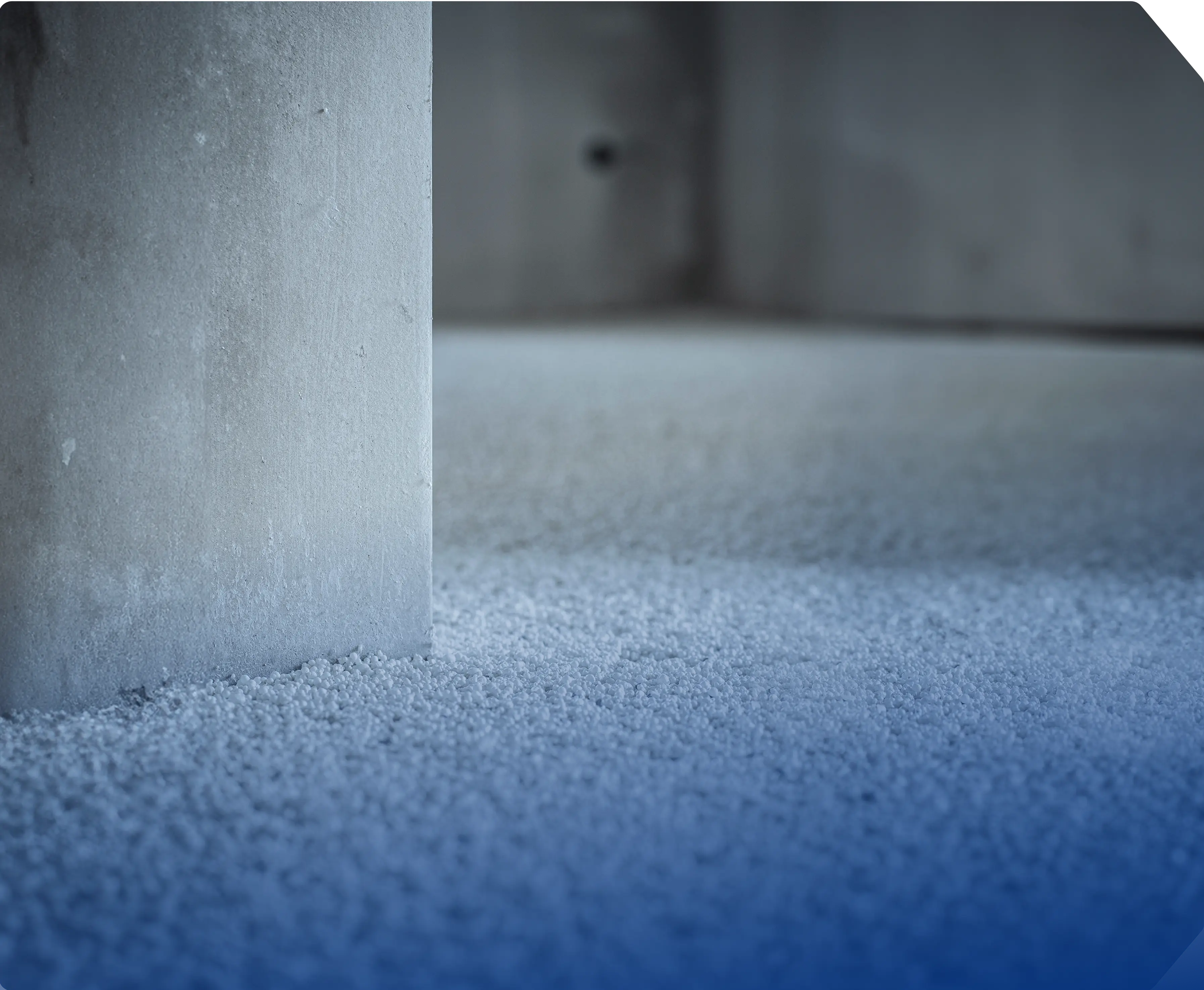 a concrete block sitting on top of a blue floor