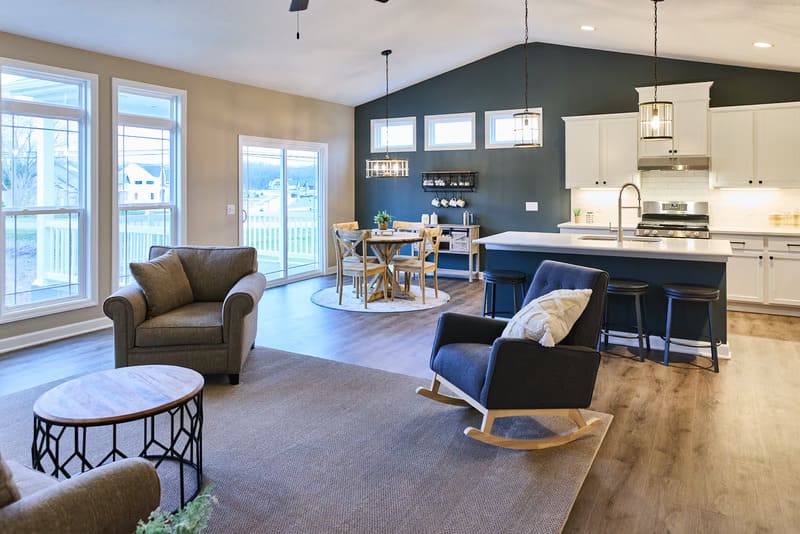 Modern open-concept living room and kitchen at GentleBrook Assisted Living South, showcasing comfortable senior apartments and amenities.