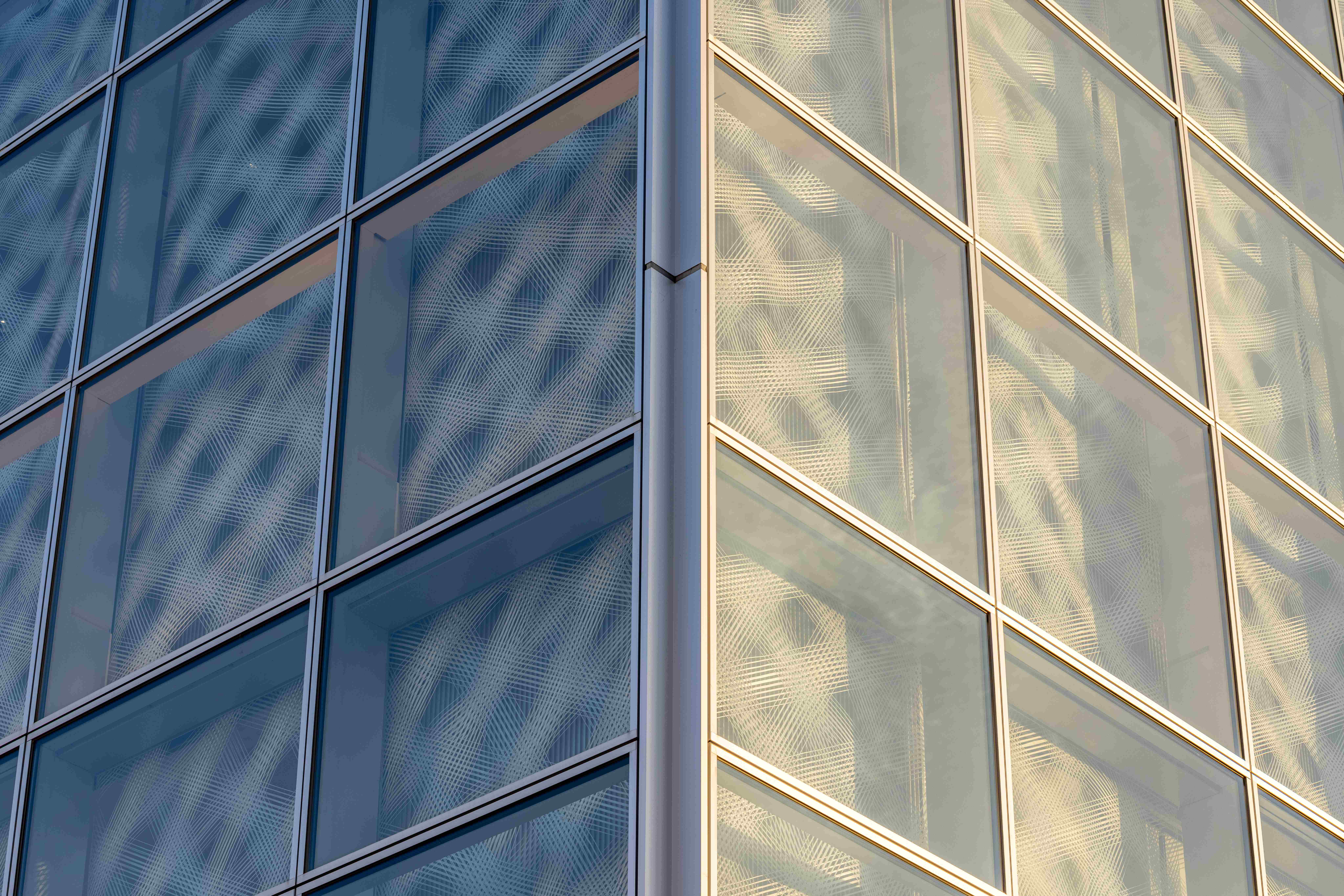 i-Mesh textile façade at building corner showing light variation and layered skin system