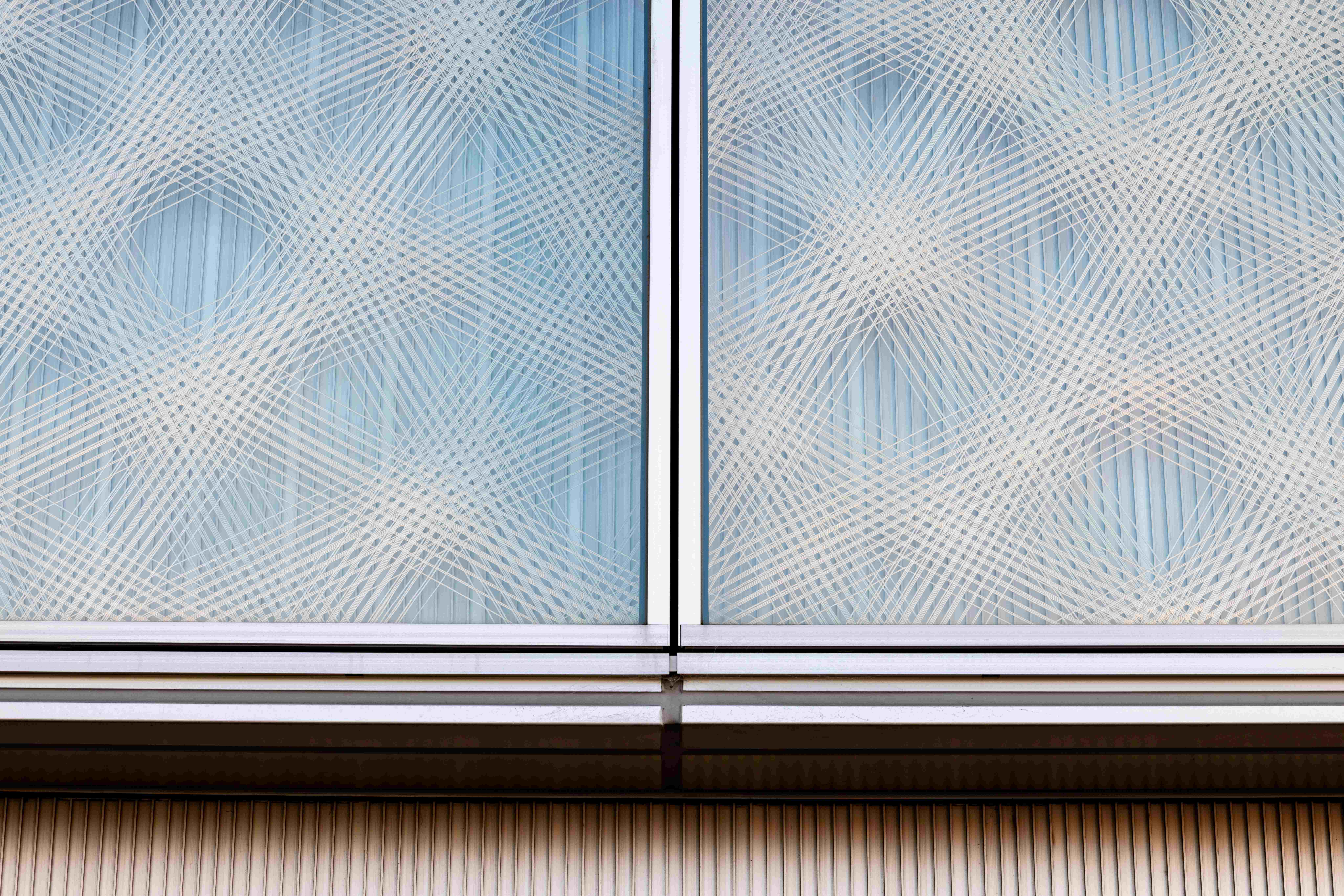 i-Mesh textile pattern module showing geometric repetition and layered façade system