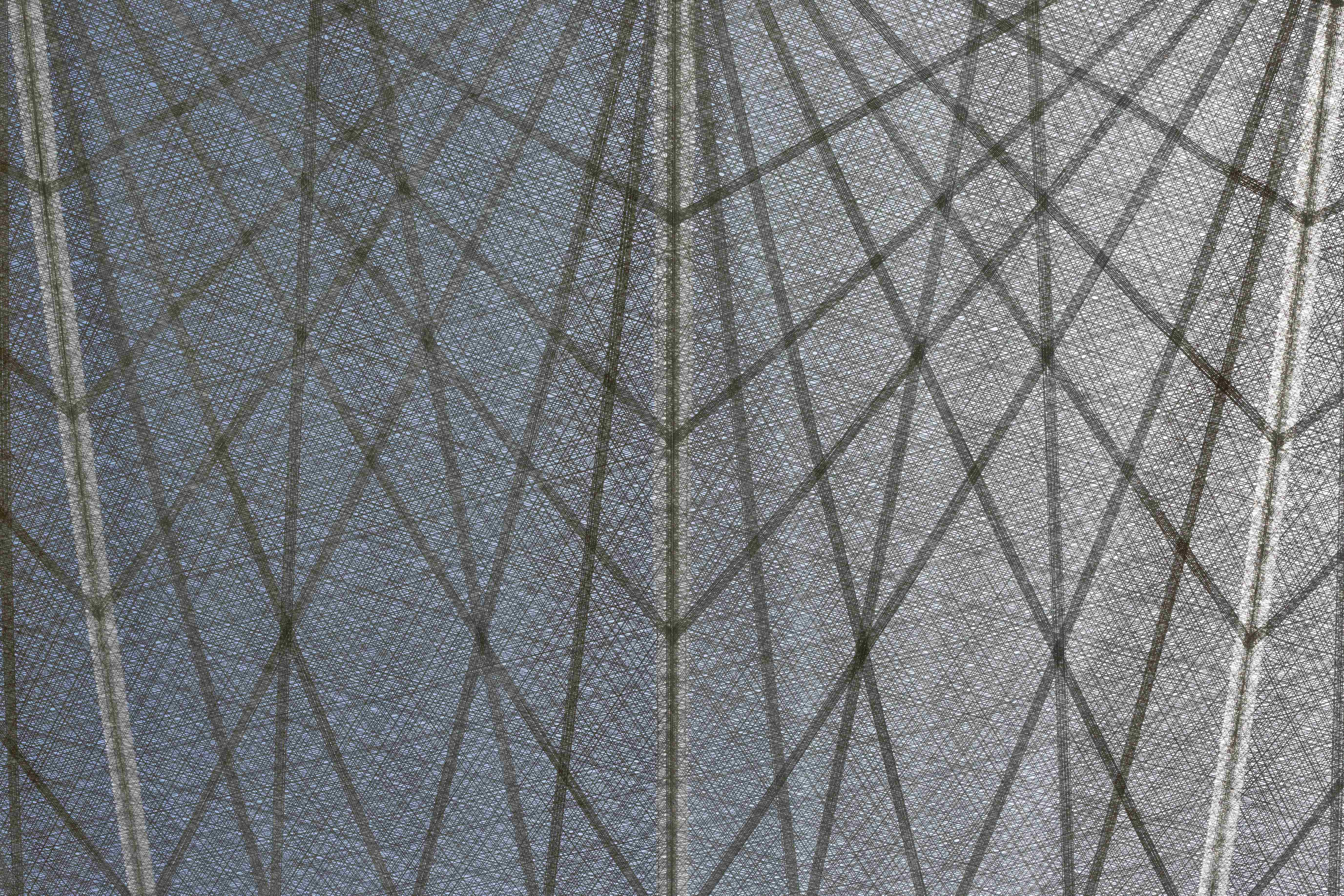 Close-up detail of the i-Mesh technical fabric featuring a custom geometric pattern designed for the solar shading system at Expo 2020 Dubai