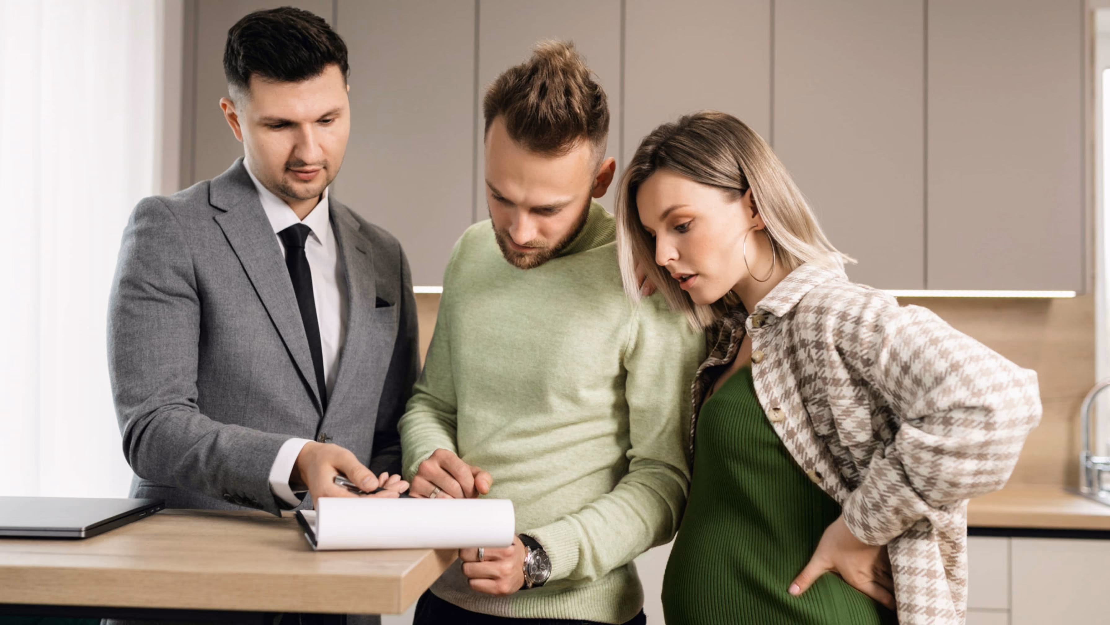 Three professionals reviewing a document