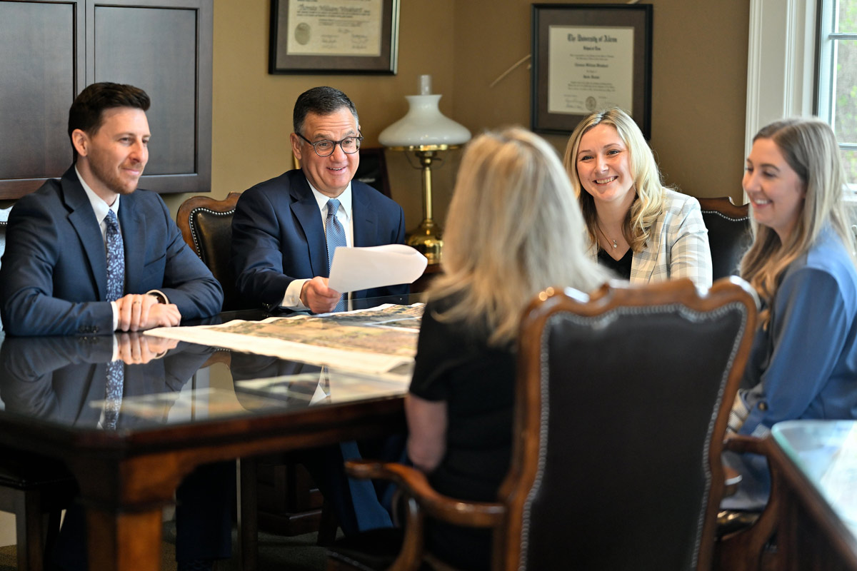 Winkhart Law Group attorneys in meeting room discussing a case
