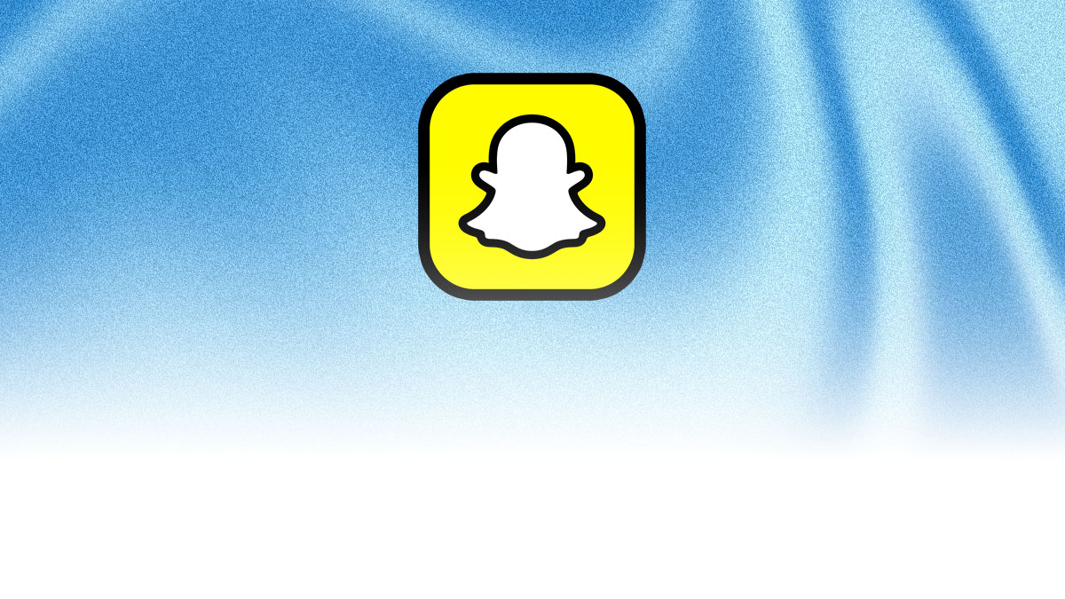 The Snapchat logo appears centered on a soft blue abstract background with subtle flowing shapes.