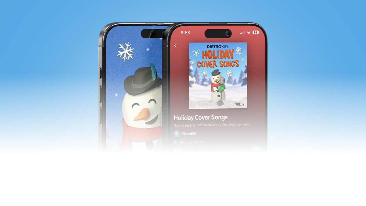 Two smartphones showing DistroKid's "Holiday Cover Songs Vol. 2" playlist, with cover art of a smiling snowman in a hat and scarf.