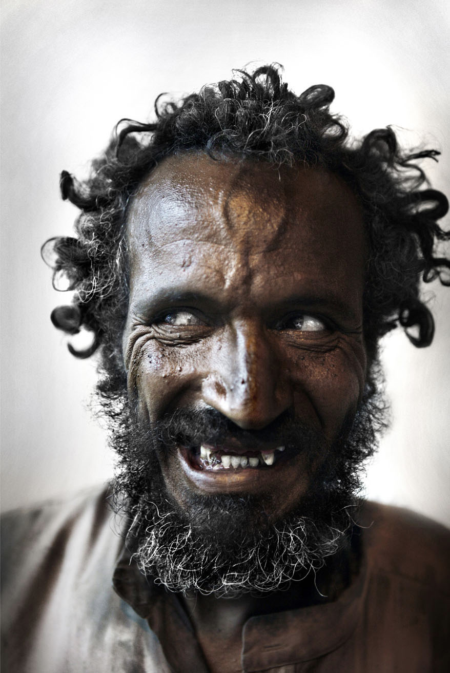 Tony Hassler captures intense portrait of man with curly beard laughing