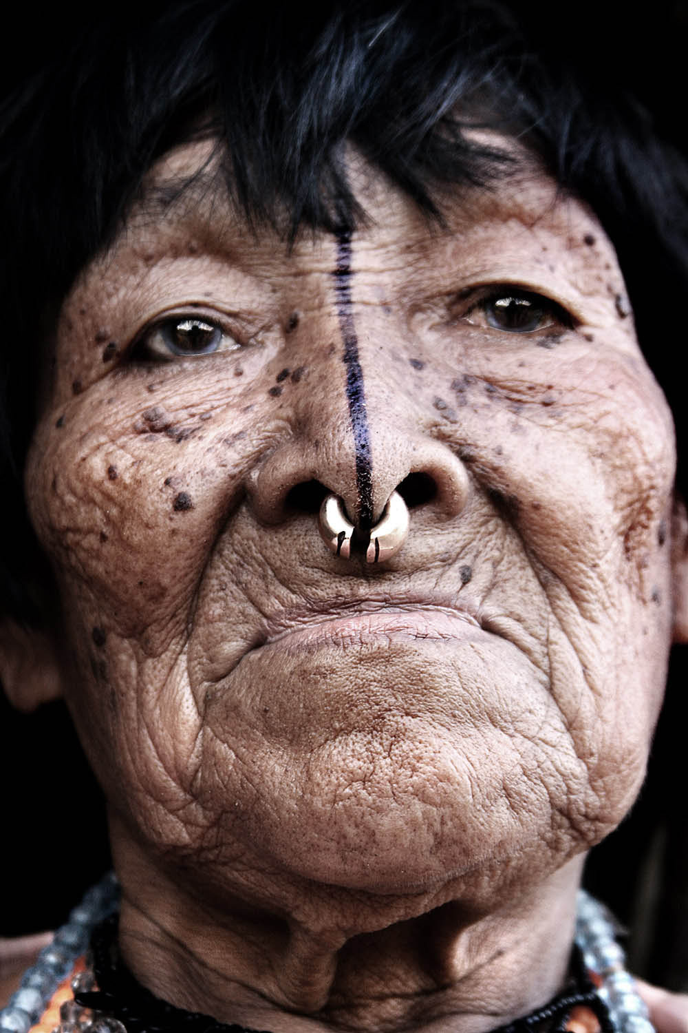 Tony Hassler's portrait of an elderly person with nose piercing and facial markings