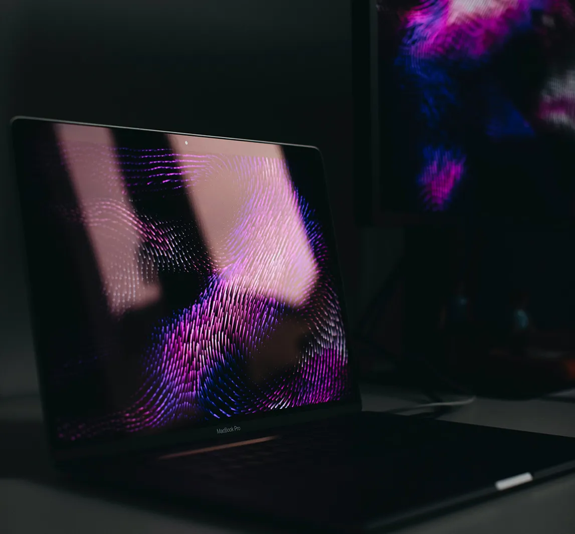 A laptop in purple light | Kelly Agency Images