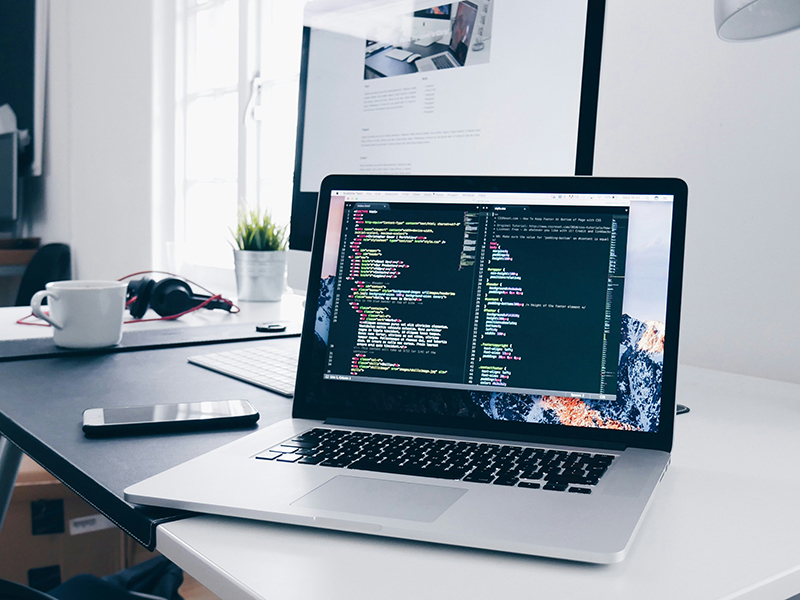 A laptop sitting on an office desk | Kelly Agency Images