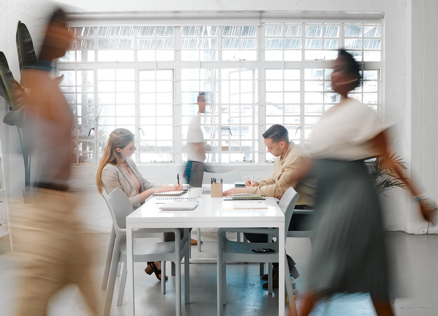 Many people walking around an office | Kelly Agency Images