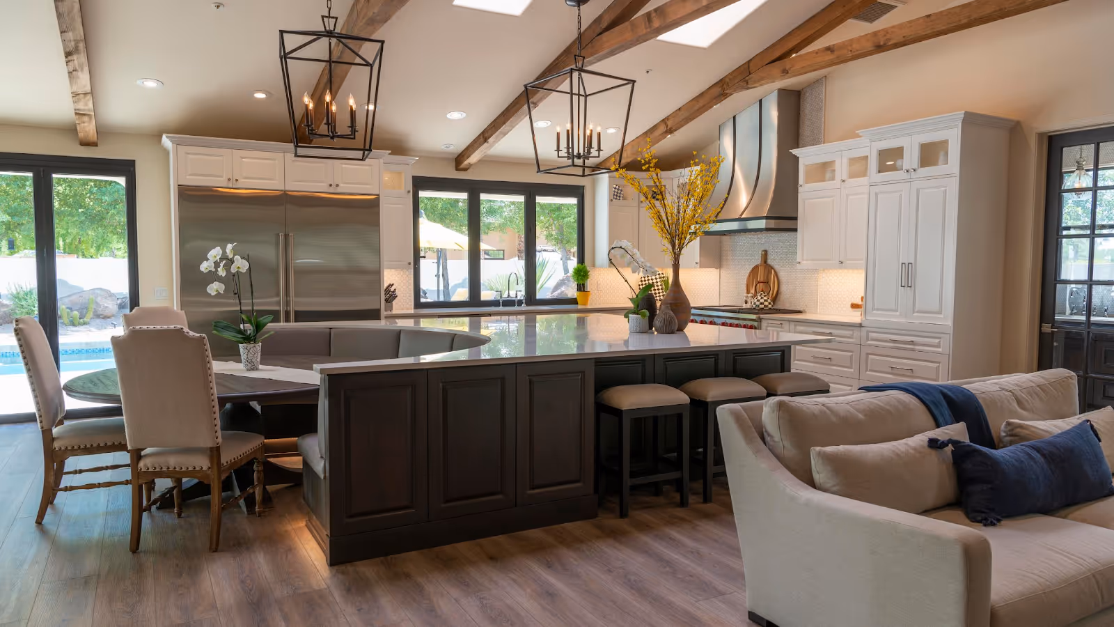 A kitchen with a large island and a large tableAI-generated content may be incorrect.