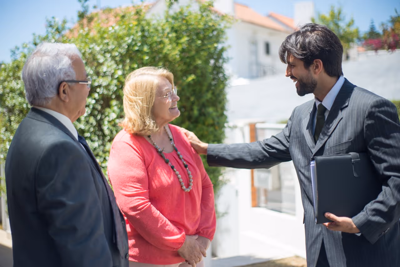 A person holding a folder with a person standing next to a personAI-generated content may be incorrect.