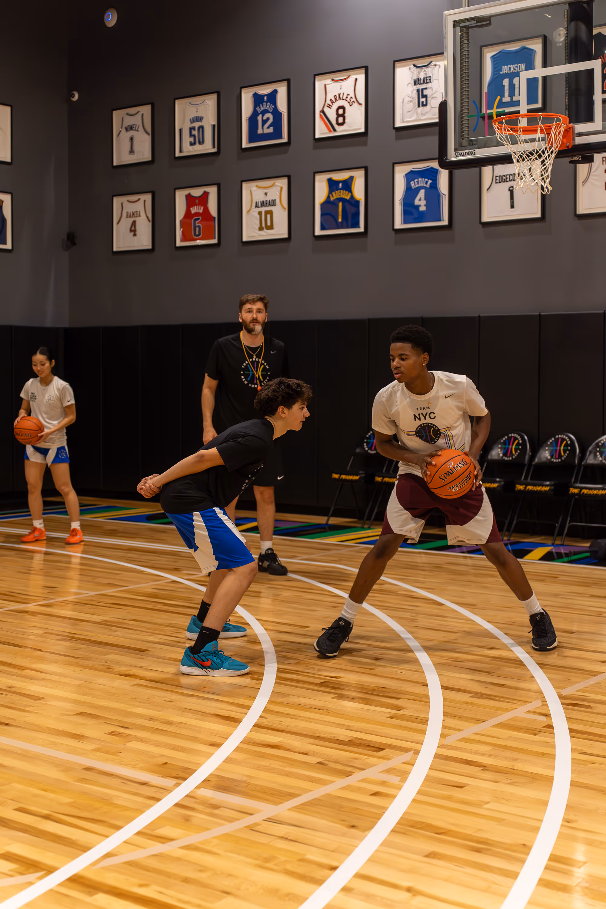 Coach teaching students basketball skills in private coaching sessions at The Program NYC