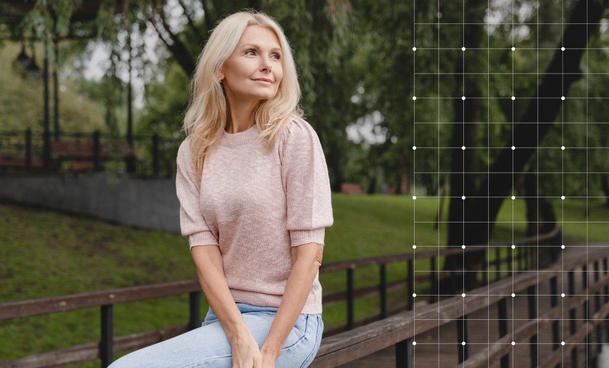 Woman sitting on a fence while contemplating