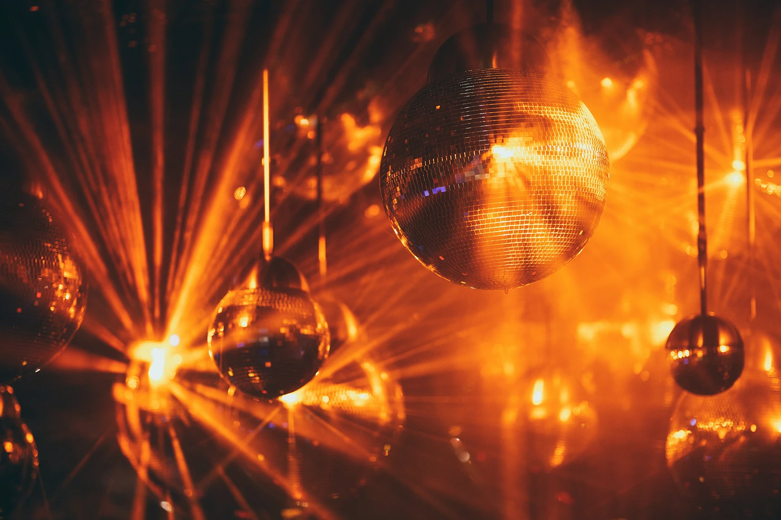 Disco Balls Glowing in an orange club scene