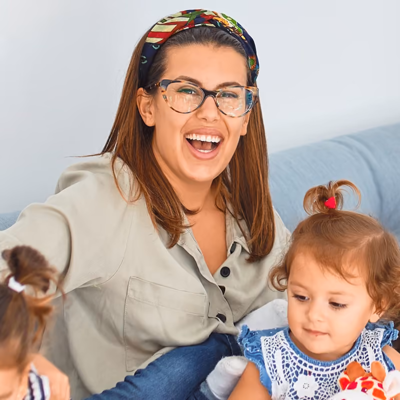 Samantha Bolan with her child playing 