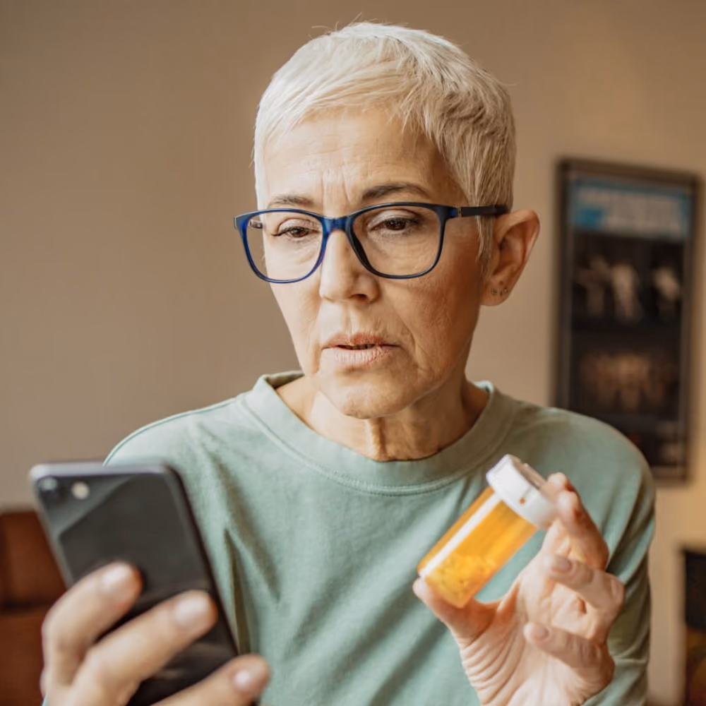 A woman with yellow jar with pills