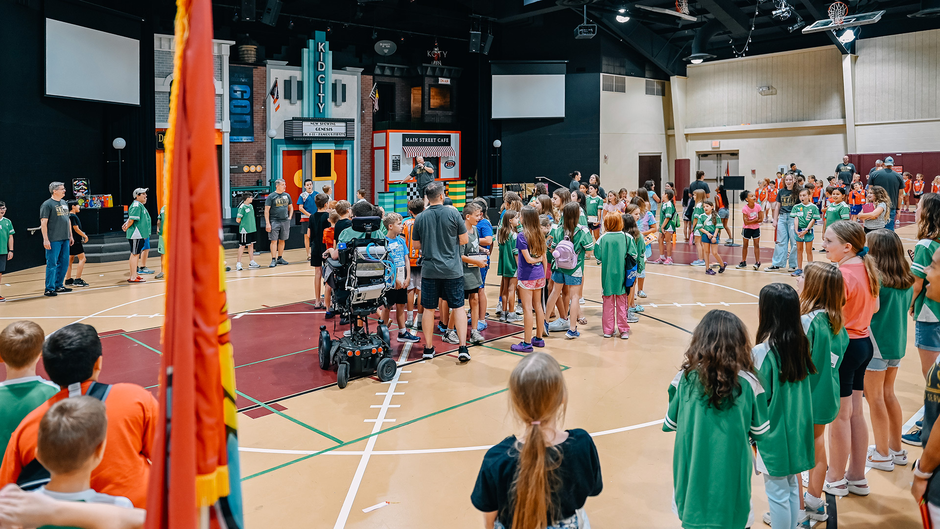 Children gather in the gym during Awana opening time.