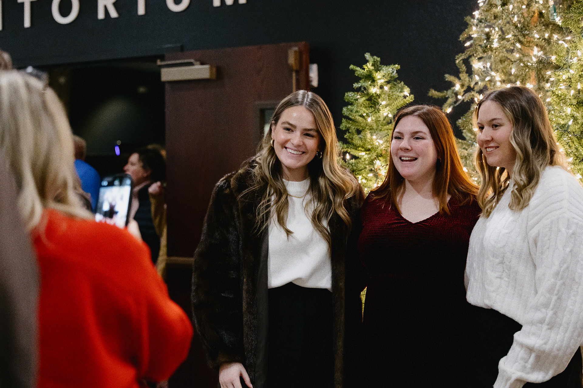 Friends gathering in the lobby at Northwest Bible Church Christmas Eve service
