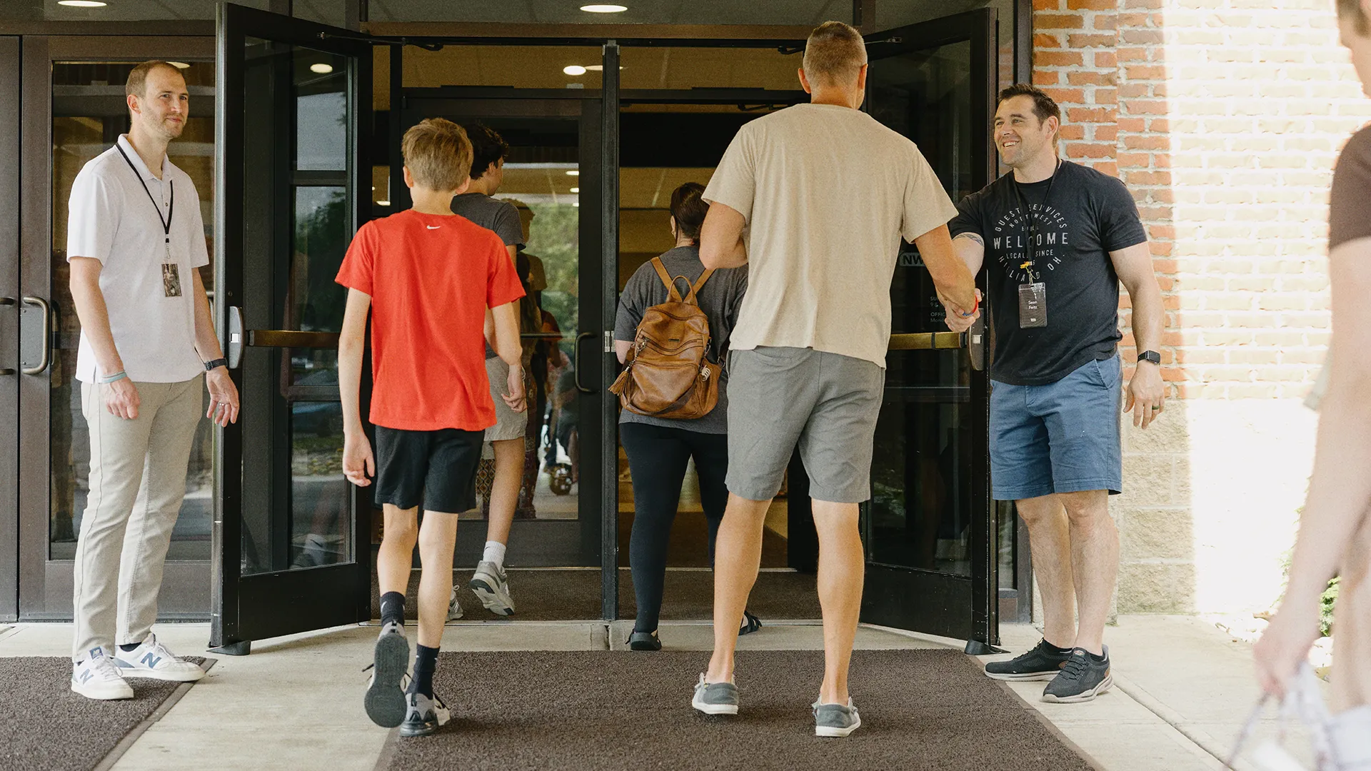 Friends hugging in the lobby