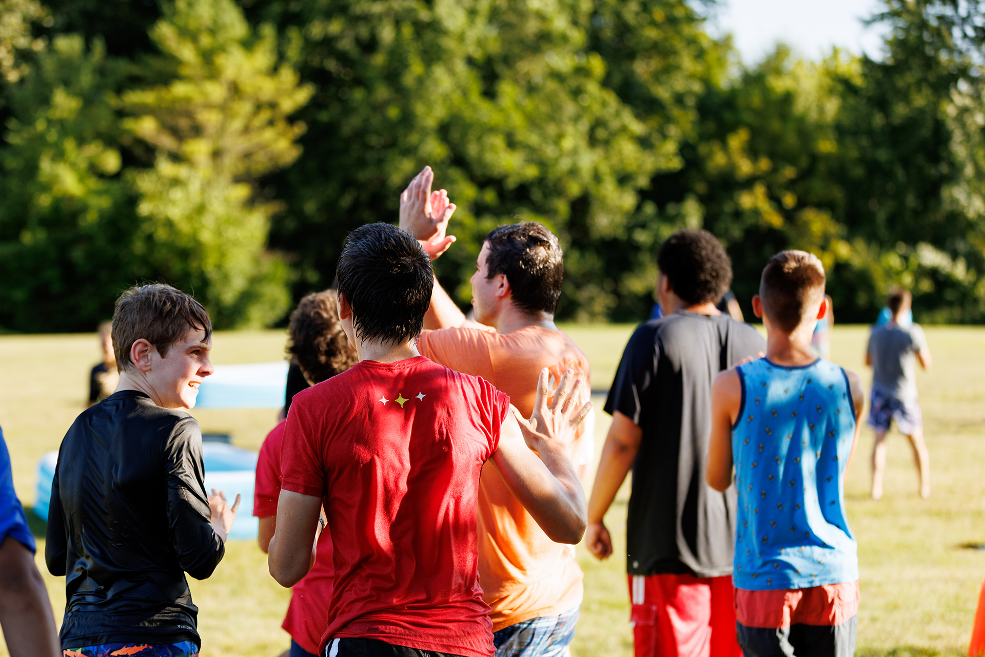teens playing kickball