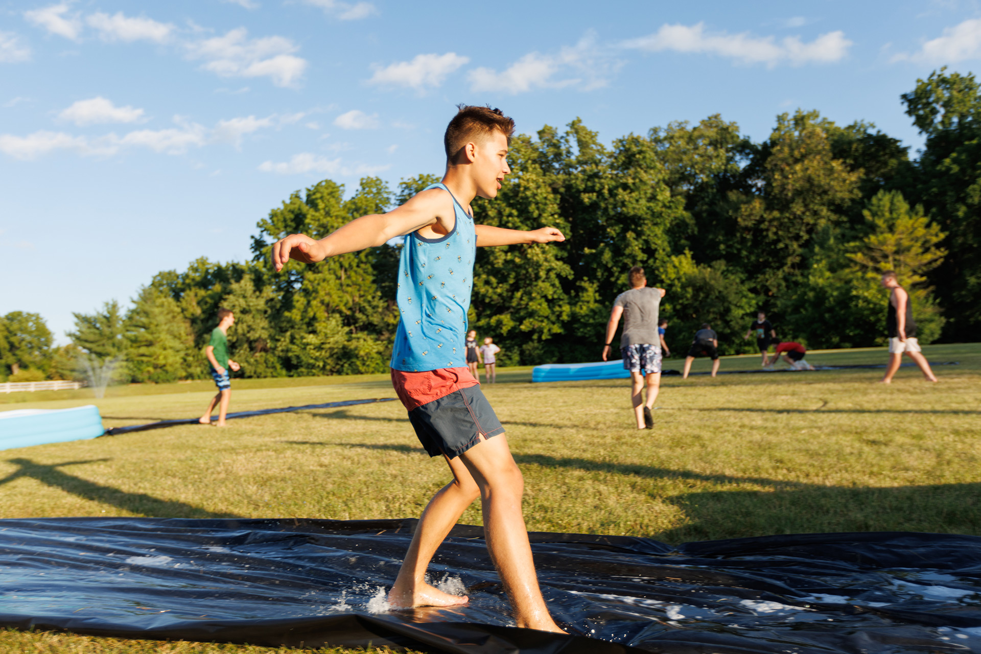 teen sliding during kickball