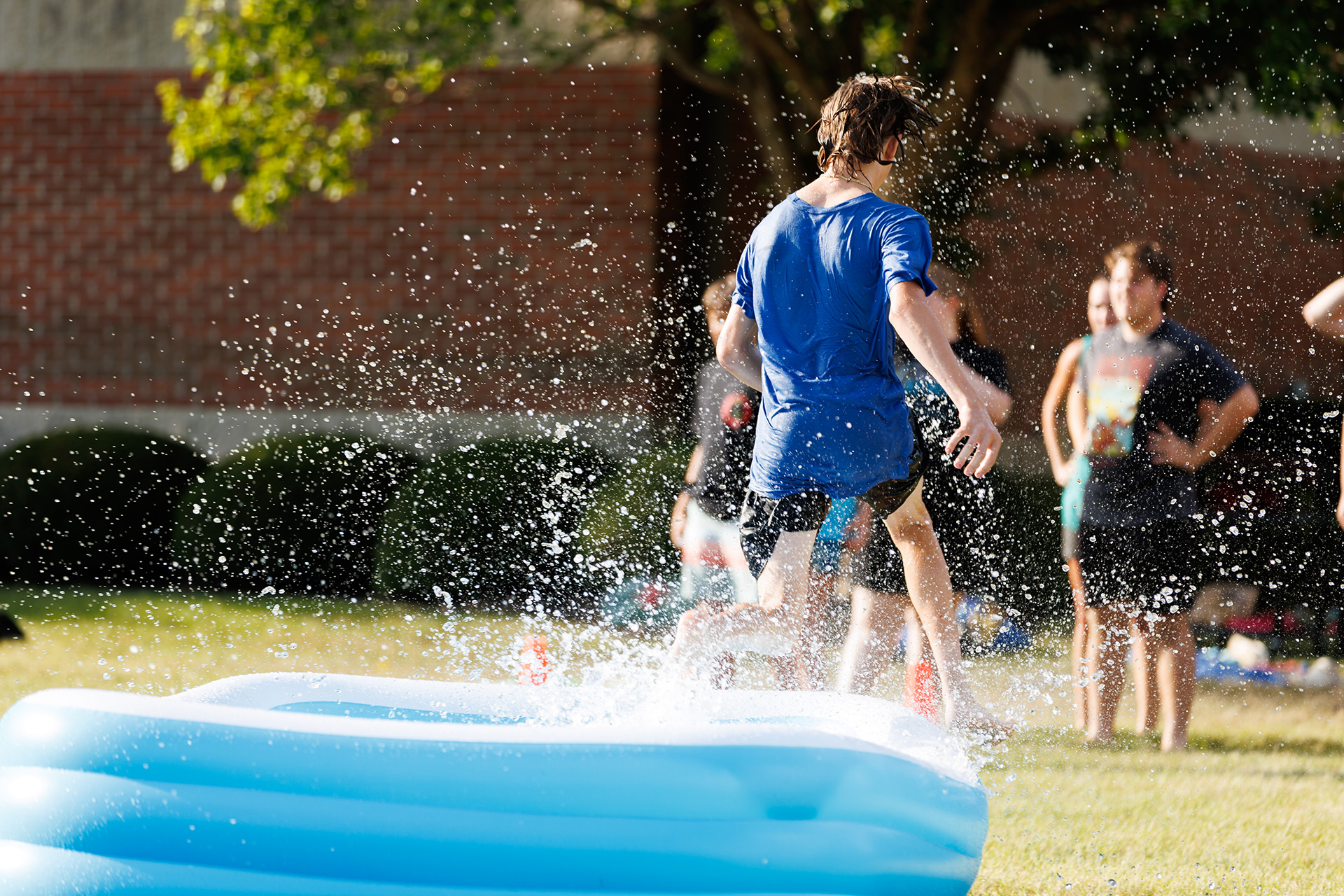 teen walking out of a pool