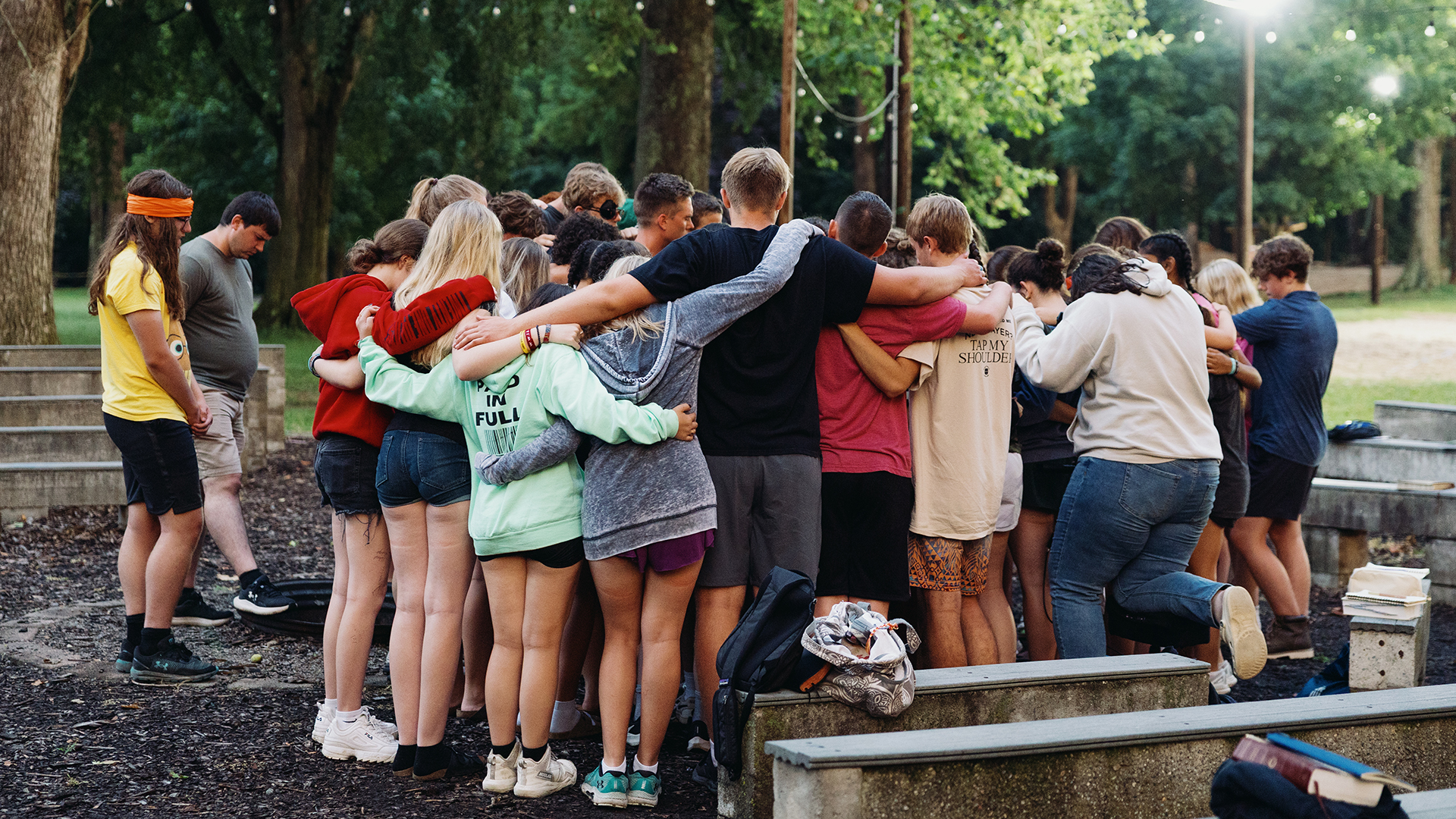 students praying together at camp