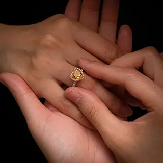 A heart-shaped engagement ring.