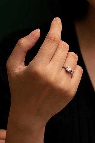 A flower-shaped diamond ring.