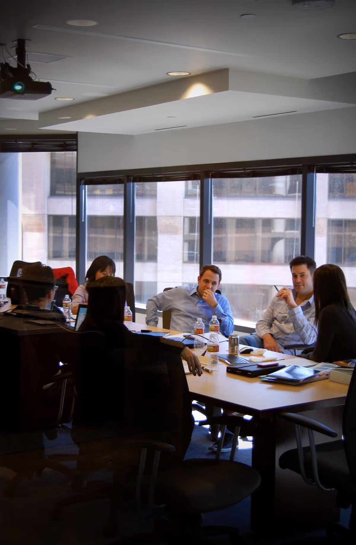 Diagram of a structured engagement approach with four color-coded sections: Diagnose (assessing business operations and issues), Design (creating actionable plans with priorities), Deliver (working with leadership to implement plans and maintain momentum), and Strengthen (building habits for long-term performance). Each section details steps and outcomes with emphasis on clarity, progress, and sustainable performance.