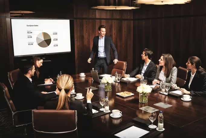 Diagram of a structured engagement approach with four color-coded sections: Diagnose (assessing business operations and issues), Design (creating actionable plans with priorities), Deliver (working with leadership to implement plans and maintain momentum), and Strengthen (building habits for long-term performance). Each section details steps and outcomes with emphasis on clarity, progress, and sustainable performance.