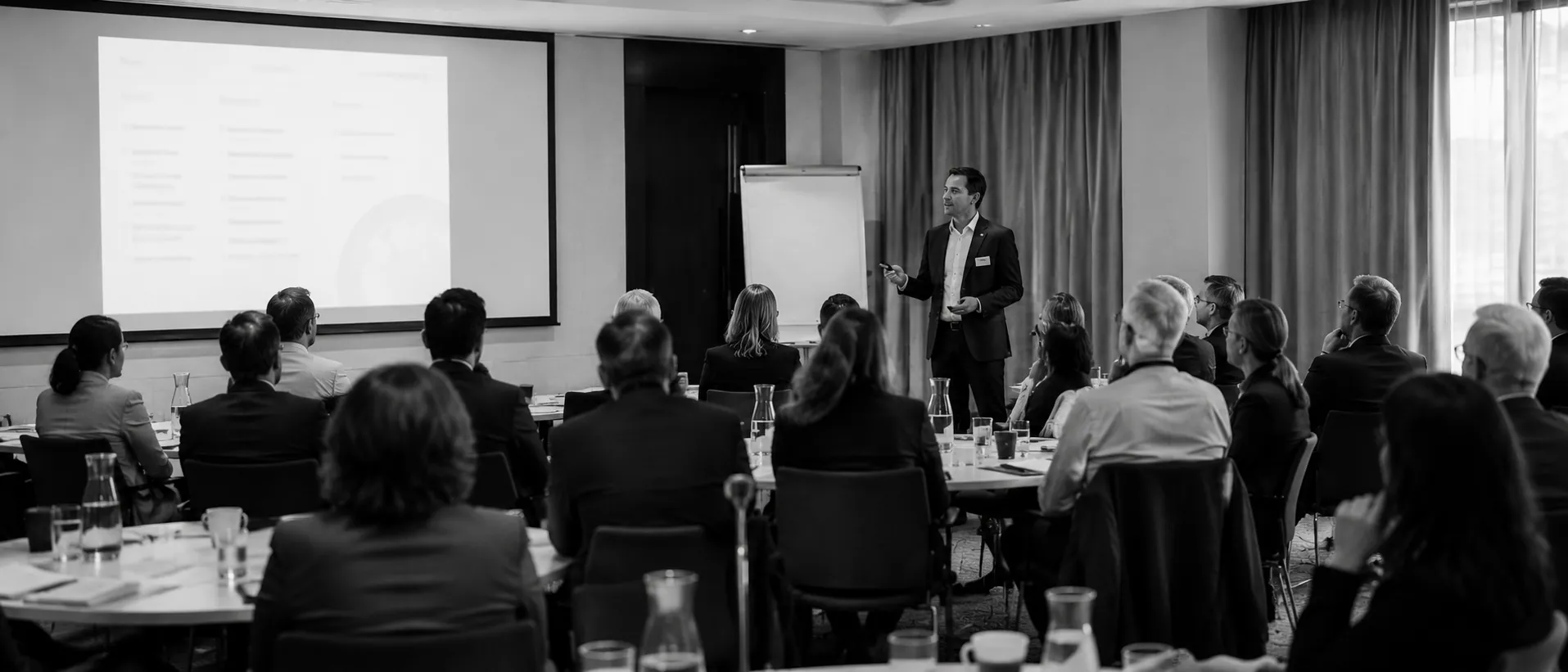 Practitioner leading an executive briefing session