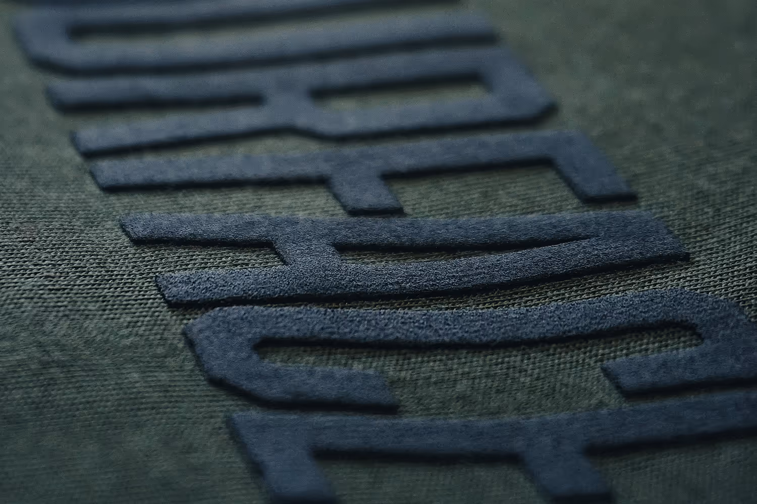 A close up image of black color high density screen printed letters.