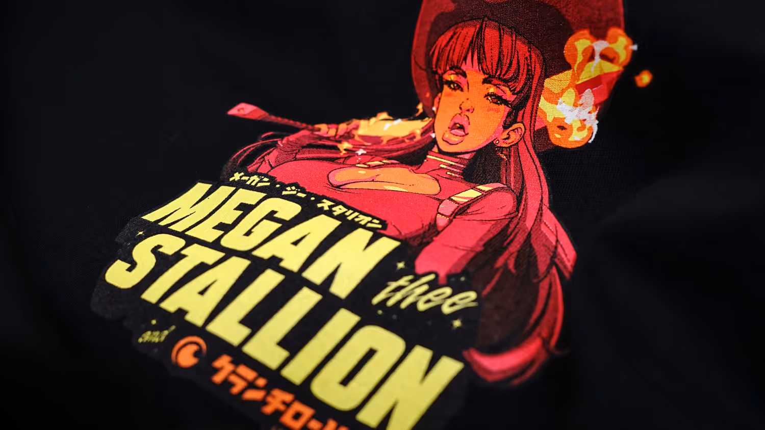 A close-up image of a small screen print featuring an anime version of Megan Thee Stallion.
